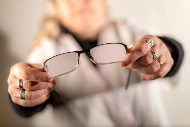 istock Oculist giving glasses 1227138515
