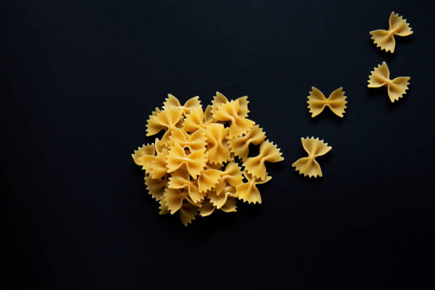 istock Farfalle pasta isolated on black background 1227140604