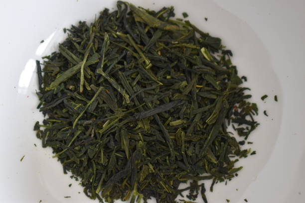 istock Green sencha tea leaves - can be used as a background 1227143723