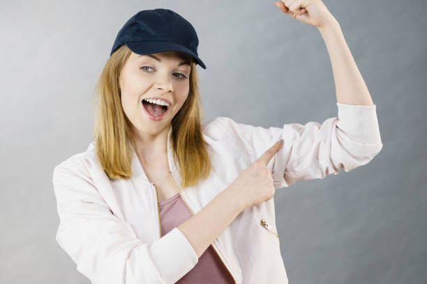 istock Young woman showing her arm muscles 1227145008
