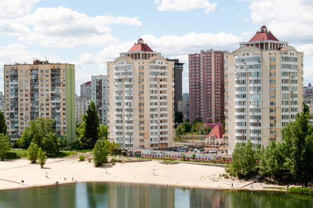 istock Buildings with beach and river or pond. 1227145077