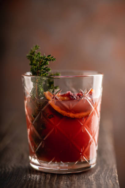 istock Old-fashioned cocktail with blood oranges and thyme on the rustic background 1227145132