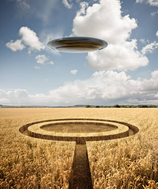 Strange Encounter - A UFO leaves Crop Circles In A Field Stranger summer encounter. A UFO leaves crop circles in a wheat crop on a hot summers day. Mixed Media 3D Illustration. crop circle stock pictures, royalty-free photos & images