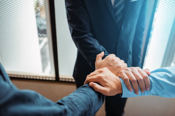 istock Business team work join hands together. group people hands were collaboration to trust in business. 1227148958