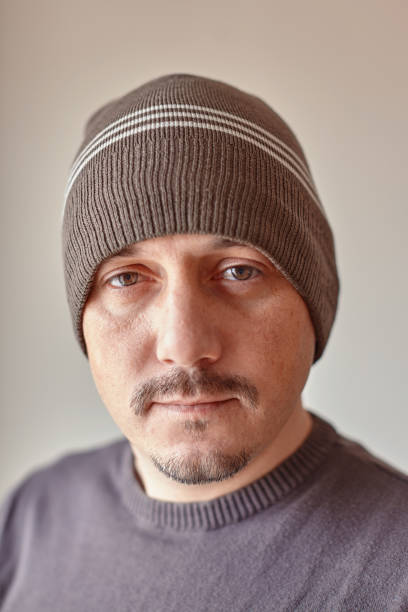 istock Portrait of a caucasian man wearing a hat looking at camera with neutral expression 1227148970