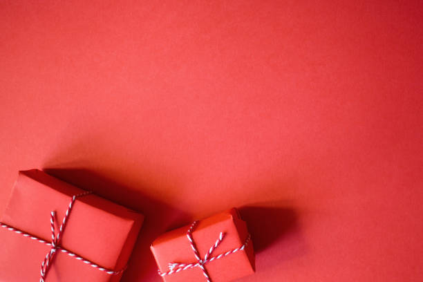 istock Christmas presents wrapped red paper. New Year flat lay top view background 1227149043