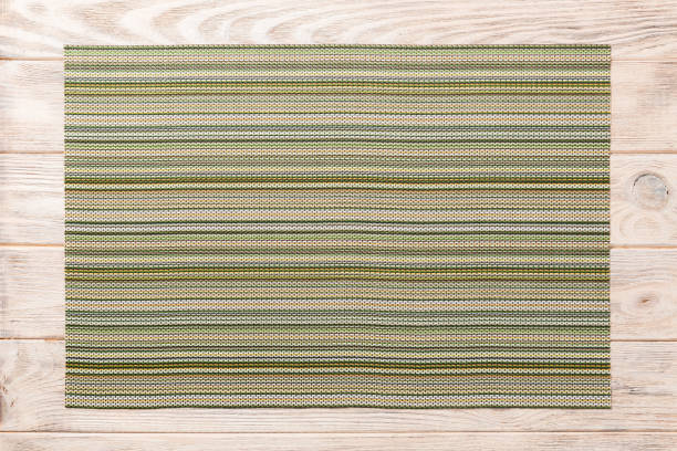 istock Top view of textile green mat for dinner on wooden background with copy space 1227149449