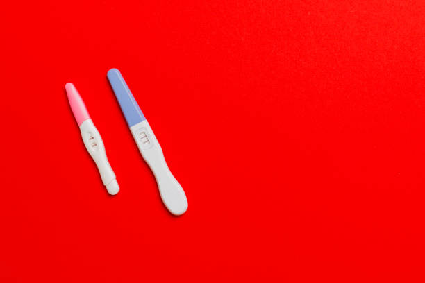 istock Colored Pregnancy test on colored background, top view with copy space 1227149456