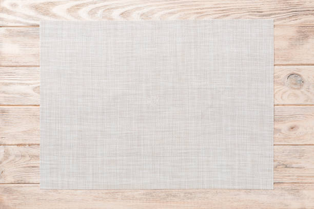 istock Top view of empty white tablecloth on wooden background with copy space 1227150359