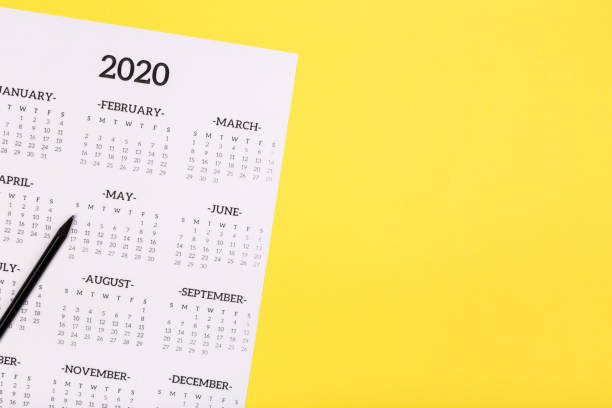 istock White clean calendar 2020  on solid yellow background with copy space, business meeting schedule, travel planning or project milestone and reminder concept. 1227152322