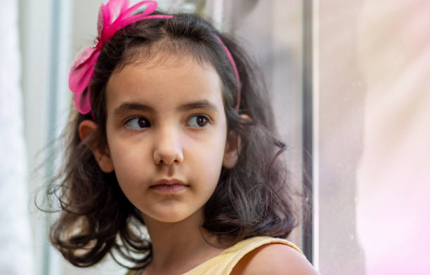 istock A girl alone gets bored at home 1227153367