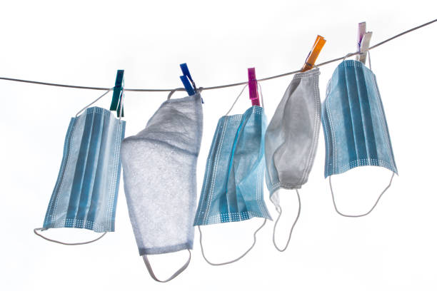 istock Disposable masks pinned with laundry pegs 1227153438