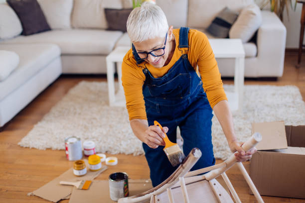 istock Mature woman enjoying during DIY work at home 1227153941