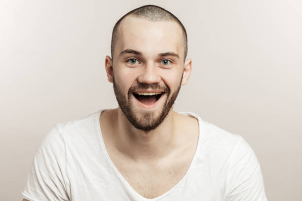 istock laughing, cheerful , happy guy with wide open mouth. 1227154356