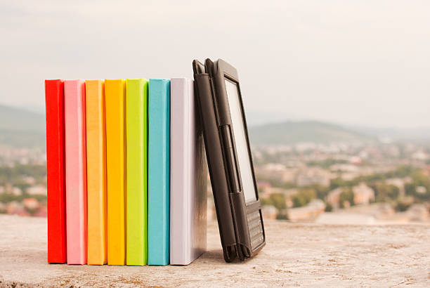 istock Row of colorful books with electronic book reader 122715680