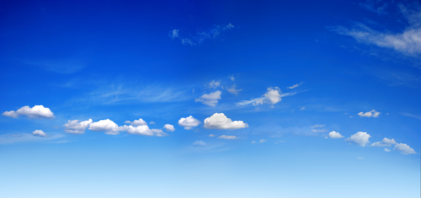 background image of sunny blue sky with white clouds