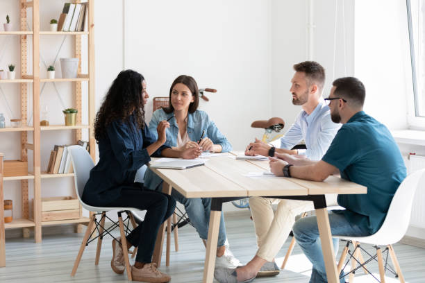 istock Diverse colleagues discuss business ideas at briefing 1227160831