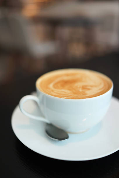 istock A cup of latte on wooden table 1227163157