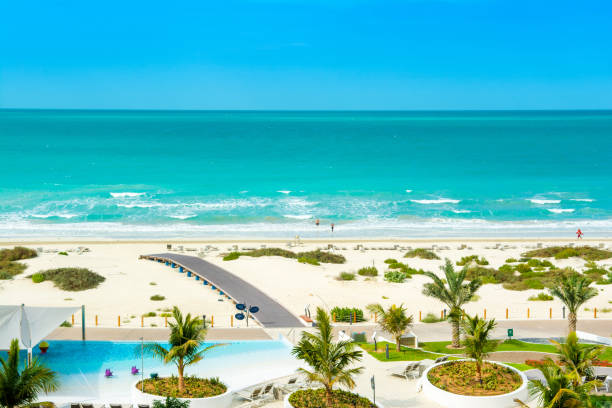 Beautiful landscape of clear turquoise ocean and sandy beach in Saadiyat island stock photo