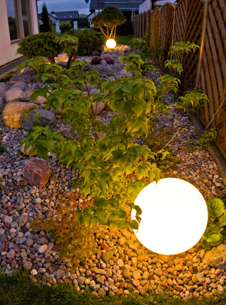 istock Home garden at night, illuminated by globe shaped lights. 1227165490