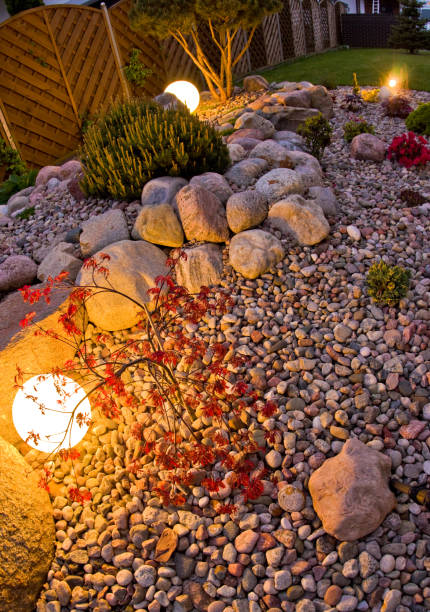istock Home garden at night, illuminated by globe shaped lights. 1227165783