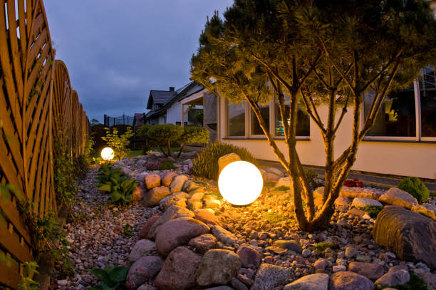 istock Home garden at night, illuminated by globe shaped lights. 1227166005