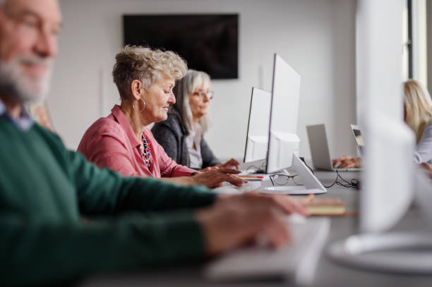 istock Group of senior people attending computer and technology education class. 1227168656