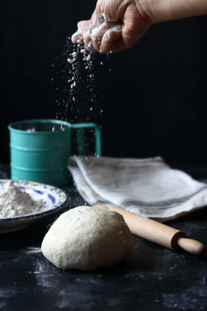 istock Dough ,making dough with flour on a black background 1227172288