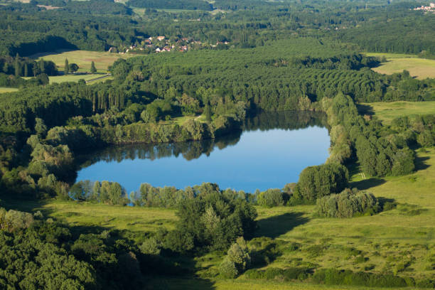 Fishing pond of Saint-Maurice-Montcouronne as seen from the sky Aerial photograph of the fishing ponds of Saint-Maurice-Montcouronne (91530), commune of the Essonne department, Île-de-France region, located 35 km south of Paris, France essonne stock pictures, royalty-free photos & images