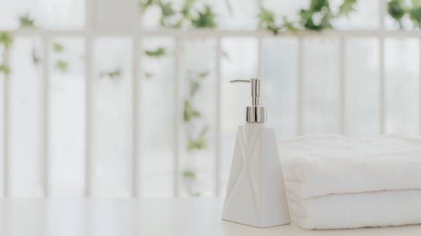 istock Shampoo and shower cream bottle with towel 1227173006