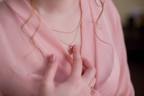 istock woman in bathrobe with breast decoration 1227173082