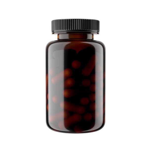 garrafa de plástico âmbar glossy com tampa preta e cápsulas, isolada em fundo branco. - amber bottle - fotografias e filmes do acervo