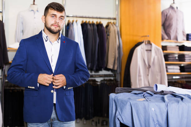 istock Adult guy customer buying jacket in store 1227174932