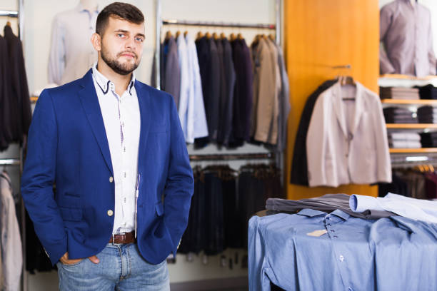 istock Brunette male customer choosing jacket 1227174933