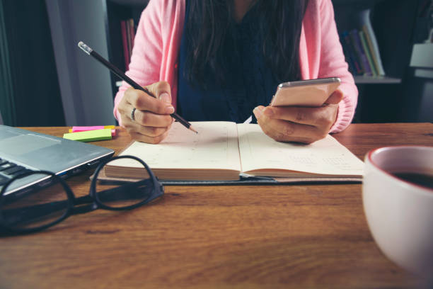 istock Planner write meeting agenda at Calendar 1227175082