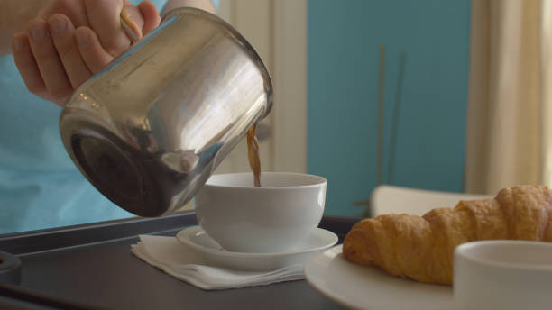 istock Male hand pouring ready made coffee into a cup 1227175164