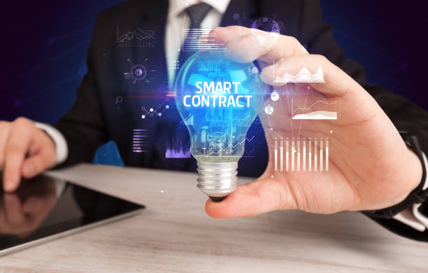 istock Businessman holding a light bulb, new business concept 1227175242