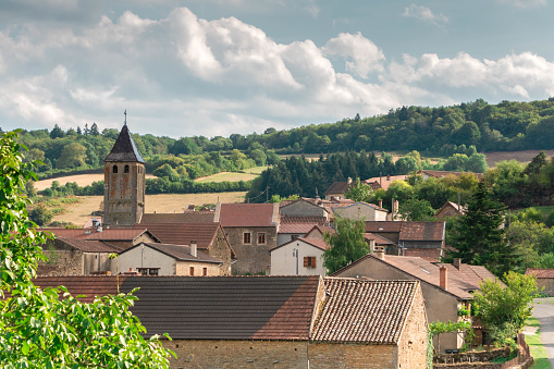 View of small town of Bourgogne in France. Village landscape with old living houses with red tile roofs. Donzy-le-Pertuis in the beautiful region of Bourgogne in eastern France