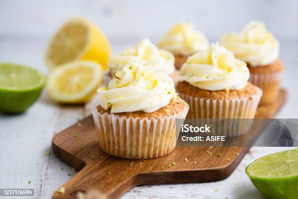 Lemon And Poppy Seed Cupcakes With Cheese Cream Frosting Stock Photo - Download Image Now