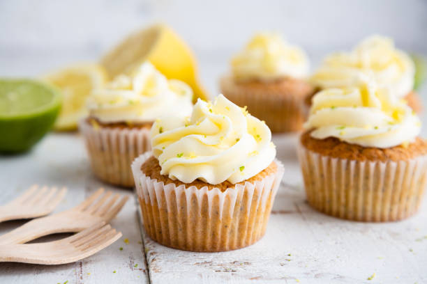 istock Lemon and poppy seed cupcakes with cheese cream frosting 1227176603