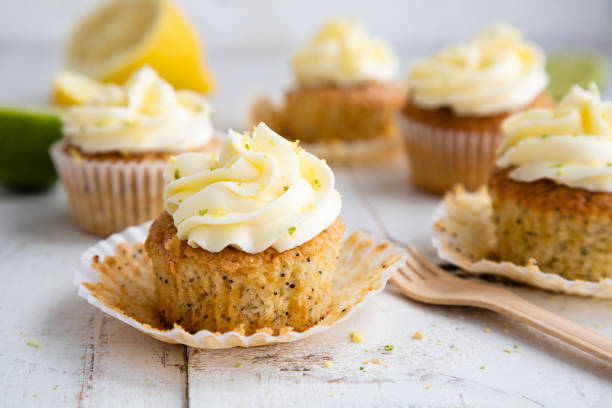 istock Lemon and poppy seed cupcakes with cheese cream frosting 1227176609