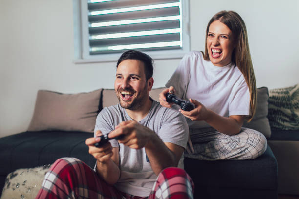 istock Young couple playing video games 1227176946