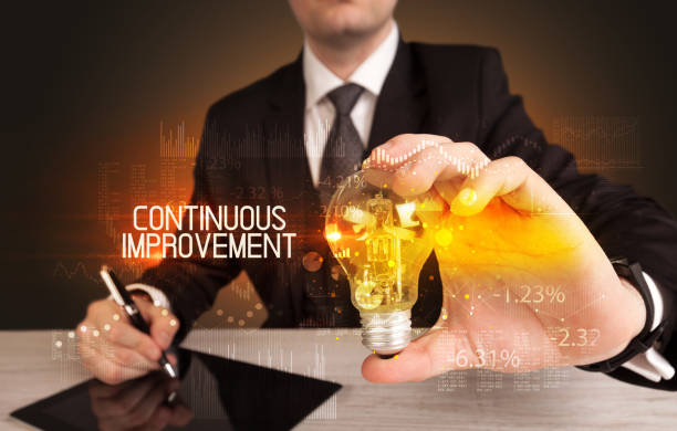 istock Businessman holding a lightbulb 1227176987