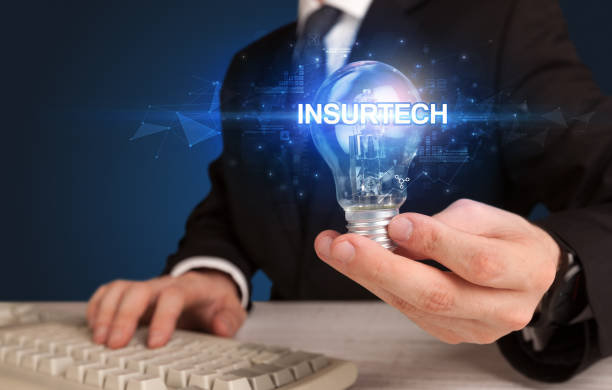 istock Businessman holding a light bulb 1227177070