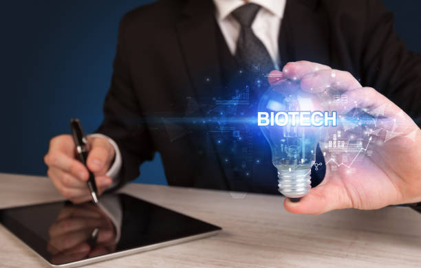 istock Businessman holding a light bulb 1227178077