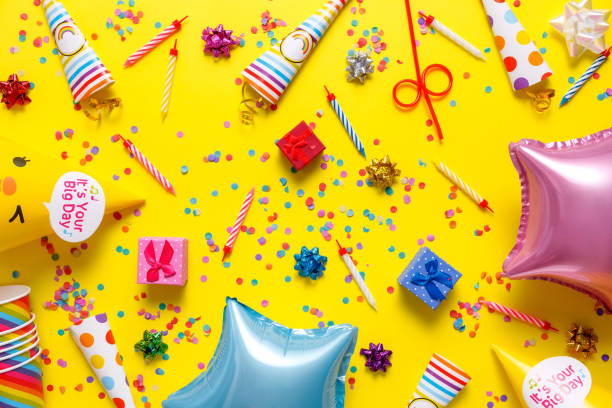 istock flatout Birthday party card on a yellow background with copy space for text 1227178172