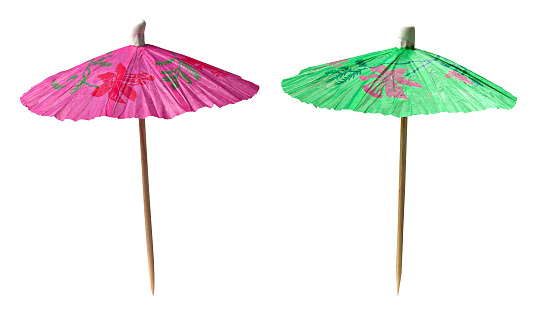colorful cocktail umbrellas isolated on white background