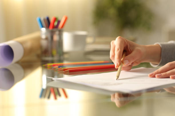 istock Designer woman drawing with pencil on a desk 1227182014
