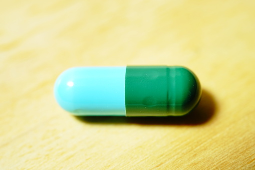 Blue green capsule pill medication