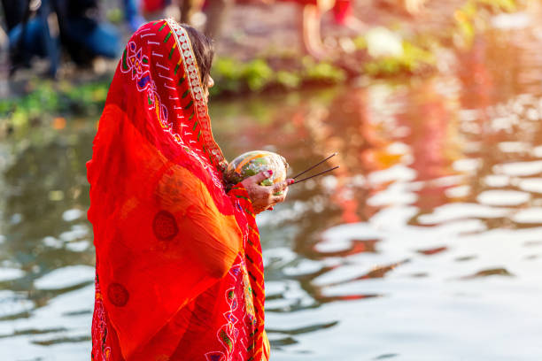 Devotee Offering Prayers To God During Chhath Puja Festival Stock Photo - Download Image Now - iStock Devotee Offering Prayers To God During Chhath Puja Festival Stock Photo - Download Image Now - iStock